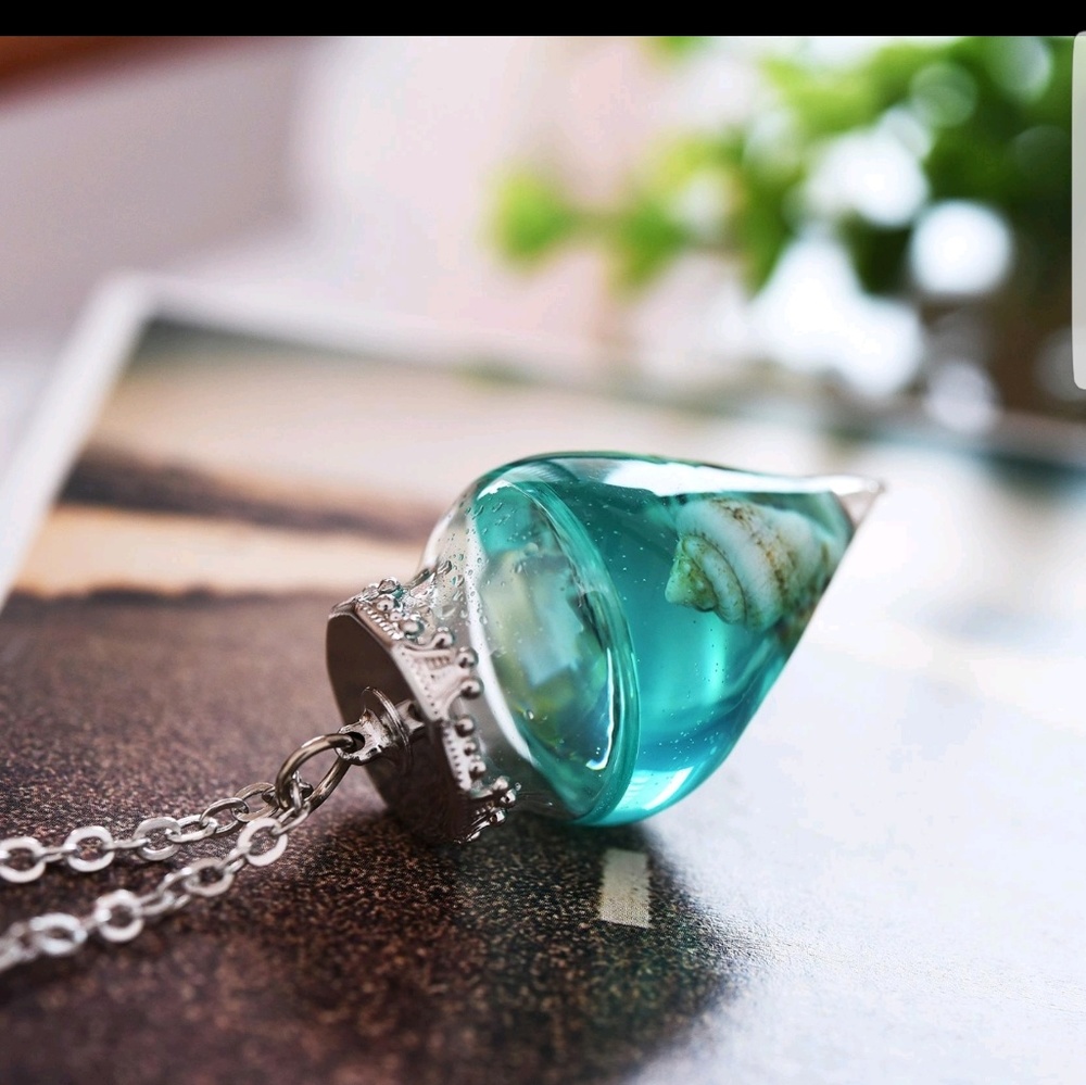 Ocean life in a large glass water drop necklace